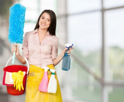 Cleaning staff using protective gloves while handling cleaning products