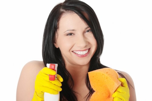 Supervisor reviewing workplace safety procedures with cleaning staff